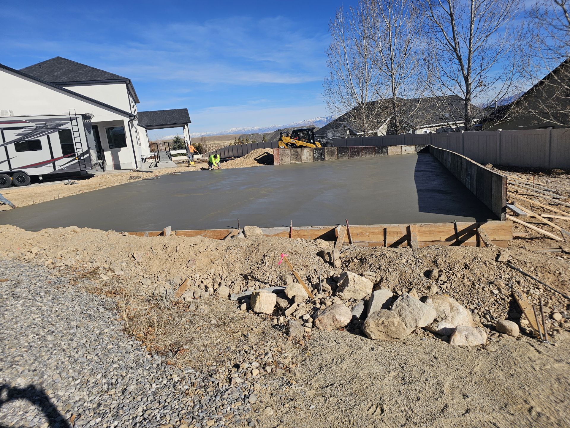 Concrete driveway pour with skid steer in Utah