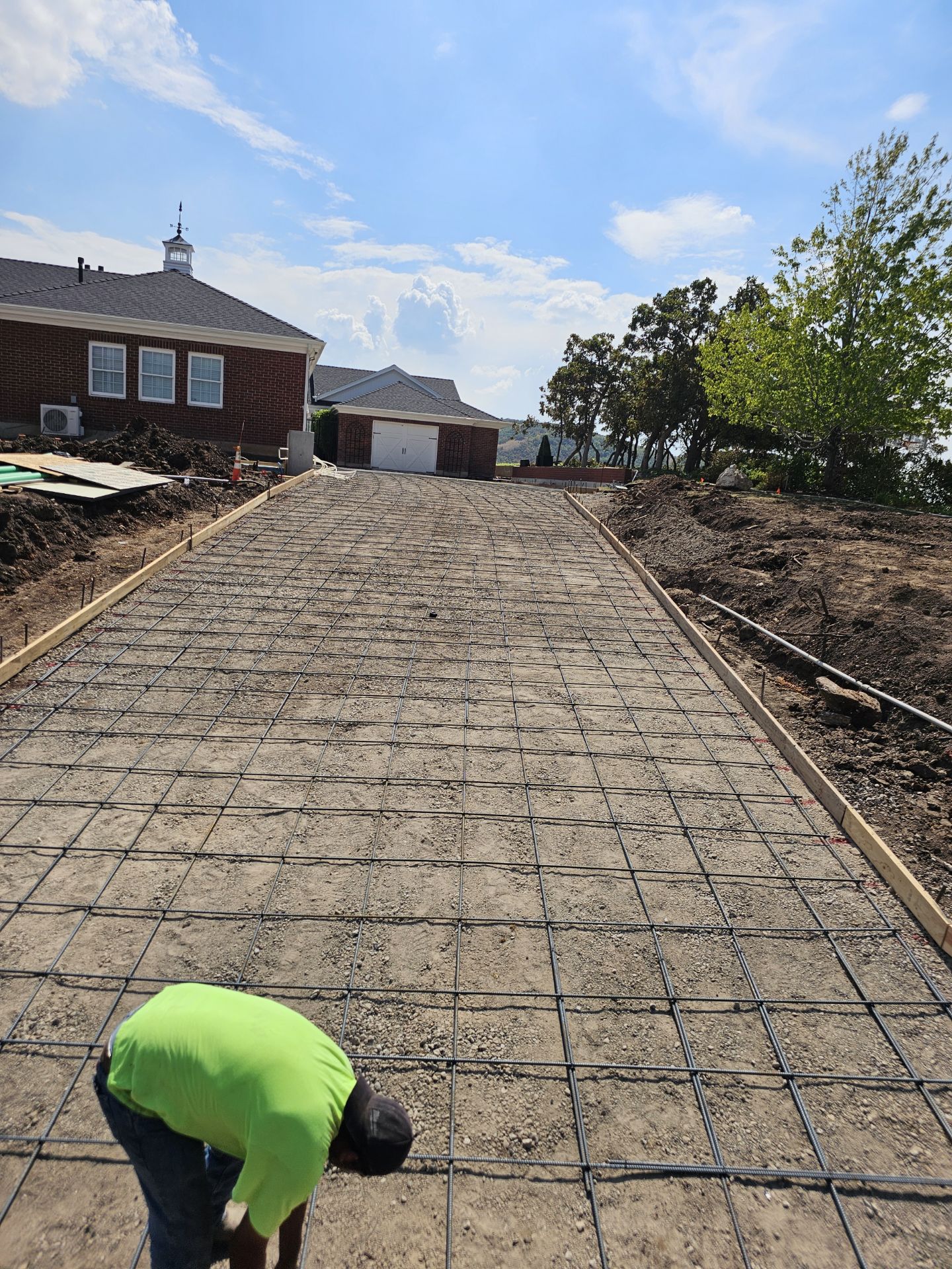 Concrete driveway prep leading to garage in Utah