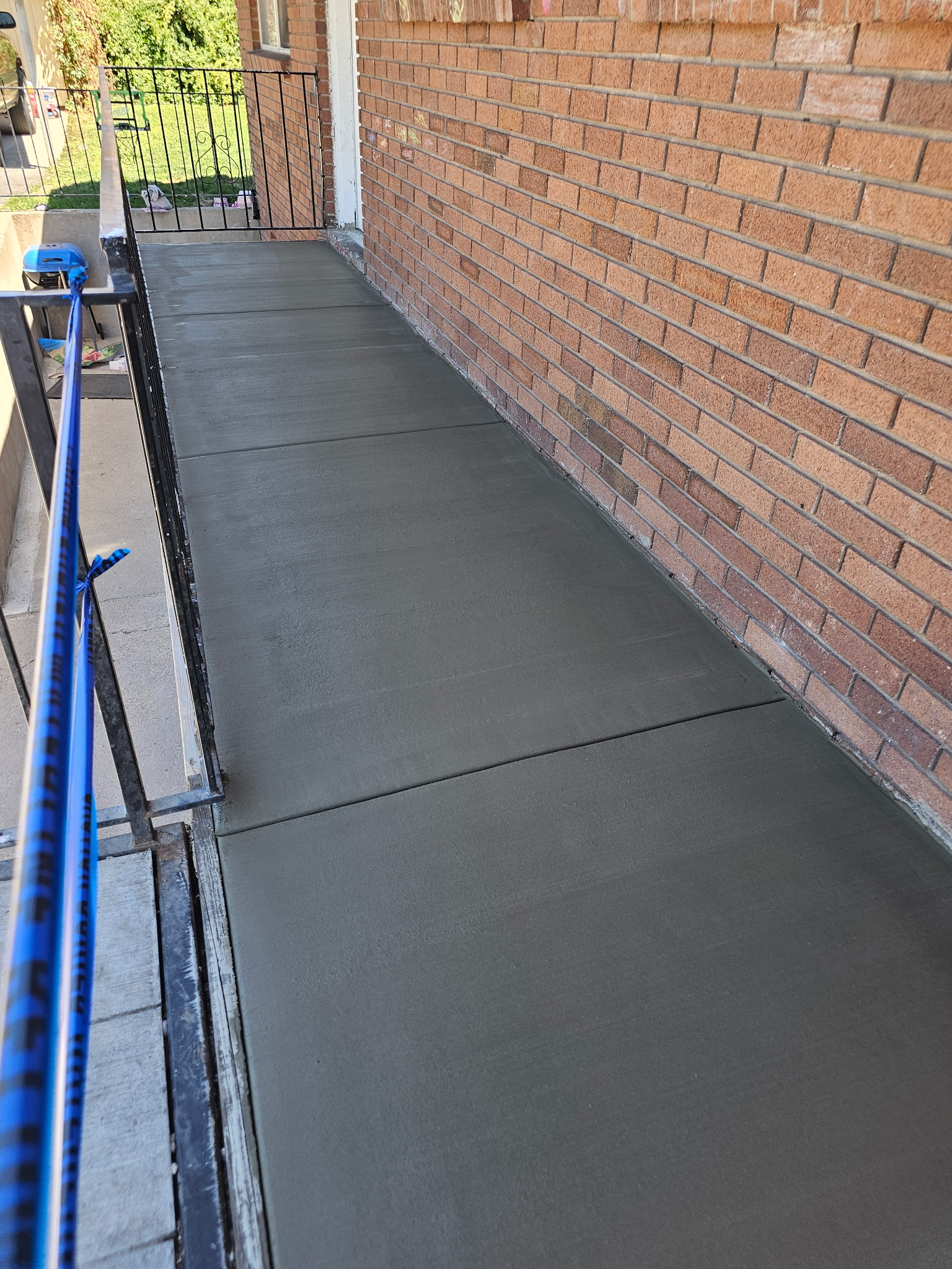 Concrete walkway with brick pillars in Utah