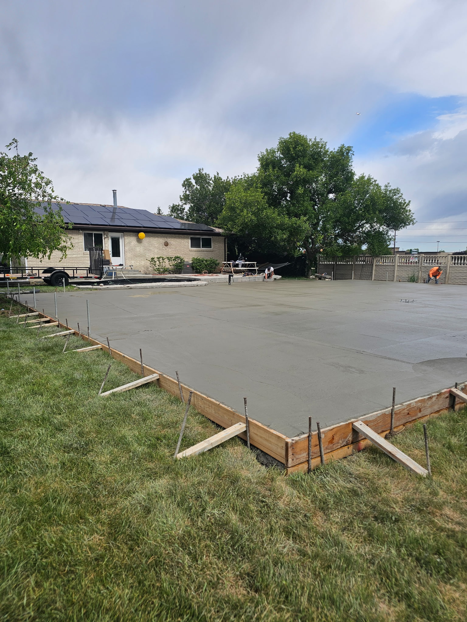 West Jordan Concrete crew pouring a new driveway in Utah