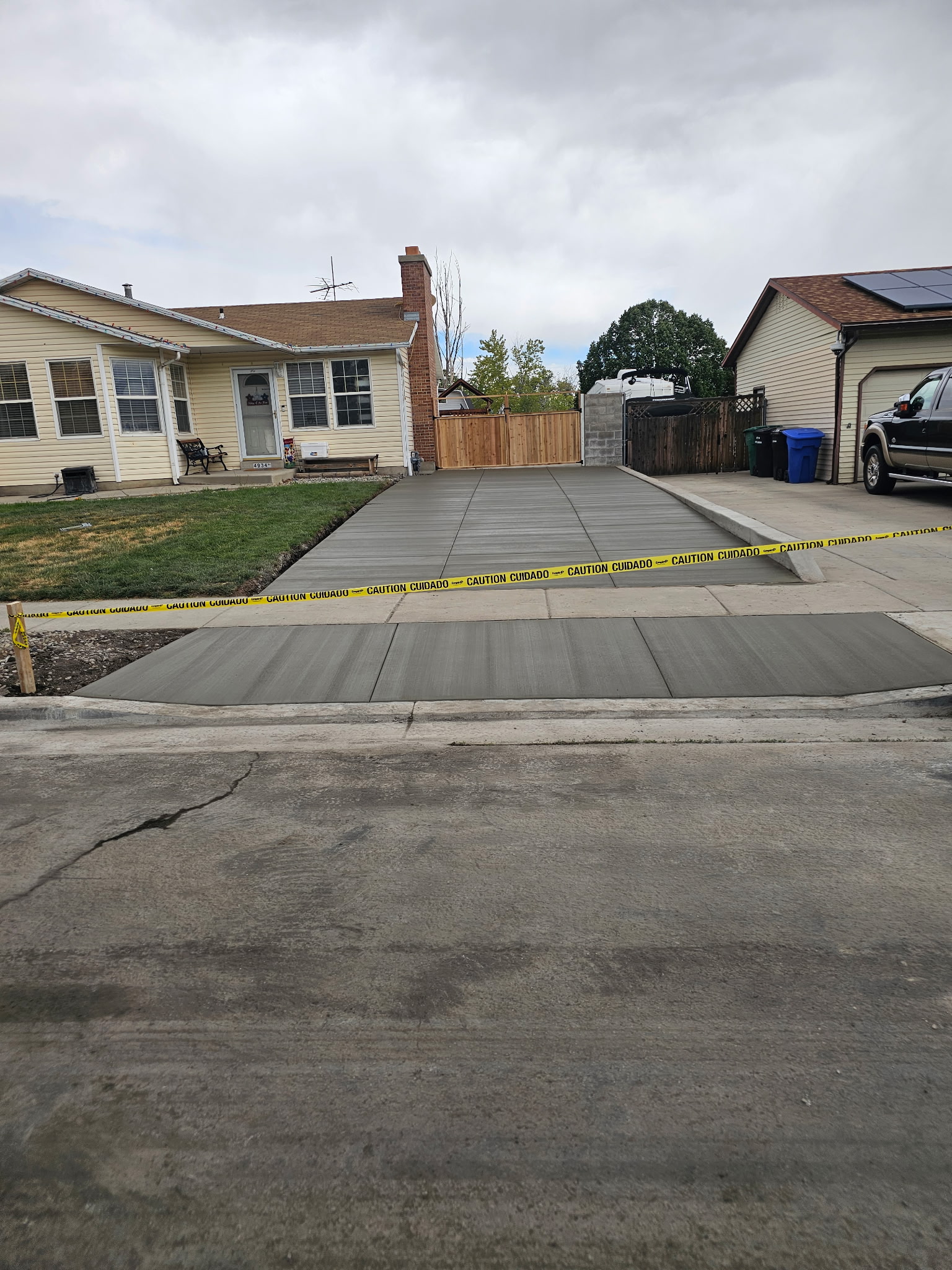 New concrete driveway and sidewalk in West Jordan, Utah